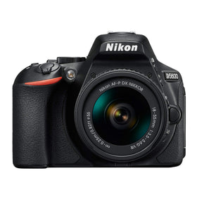 Nikon D5600 side grip in hand for stable travel photography
