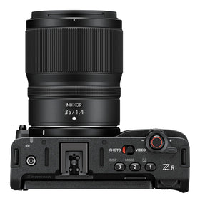 Kit includes body, battery, USB-C, strap, and prime lens