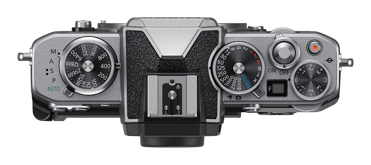 Nikon Z fc retro dials close-up emphasizes tactile shooting control in daylight.