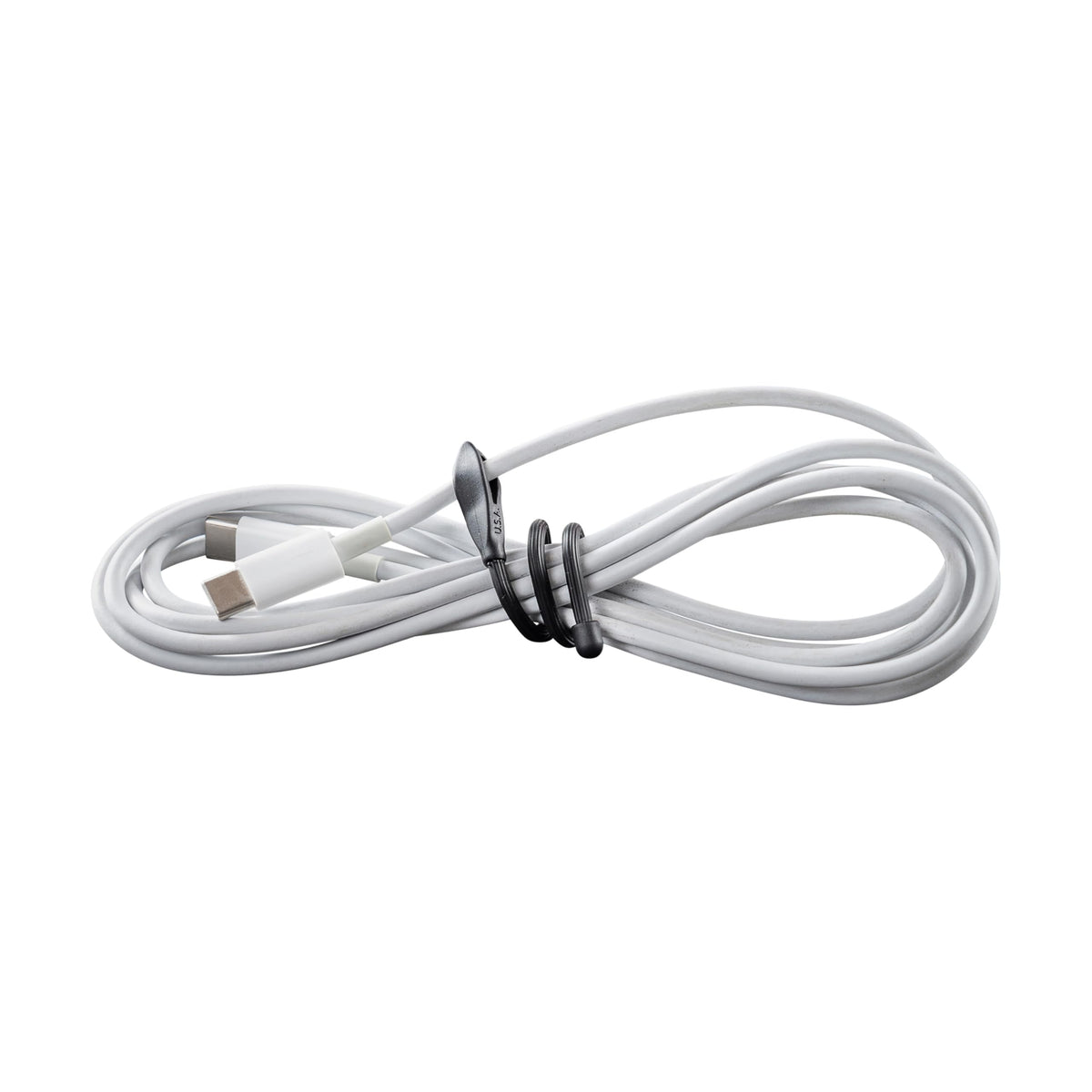 Nite Ize securing earbuds to prevent tangles while traveling