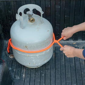 Nite Ize securing camping gear outdoors for reliable transport