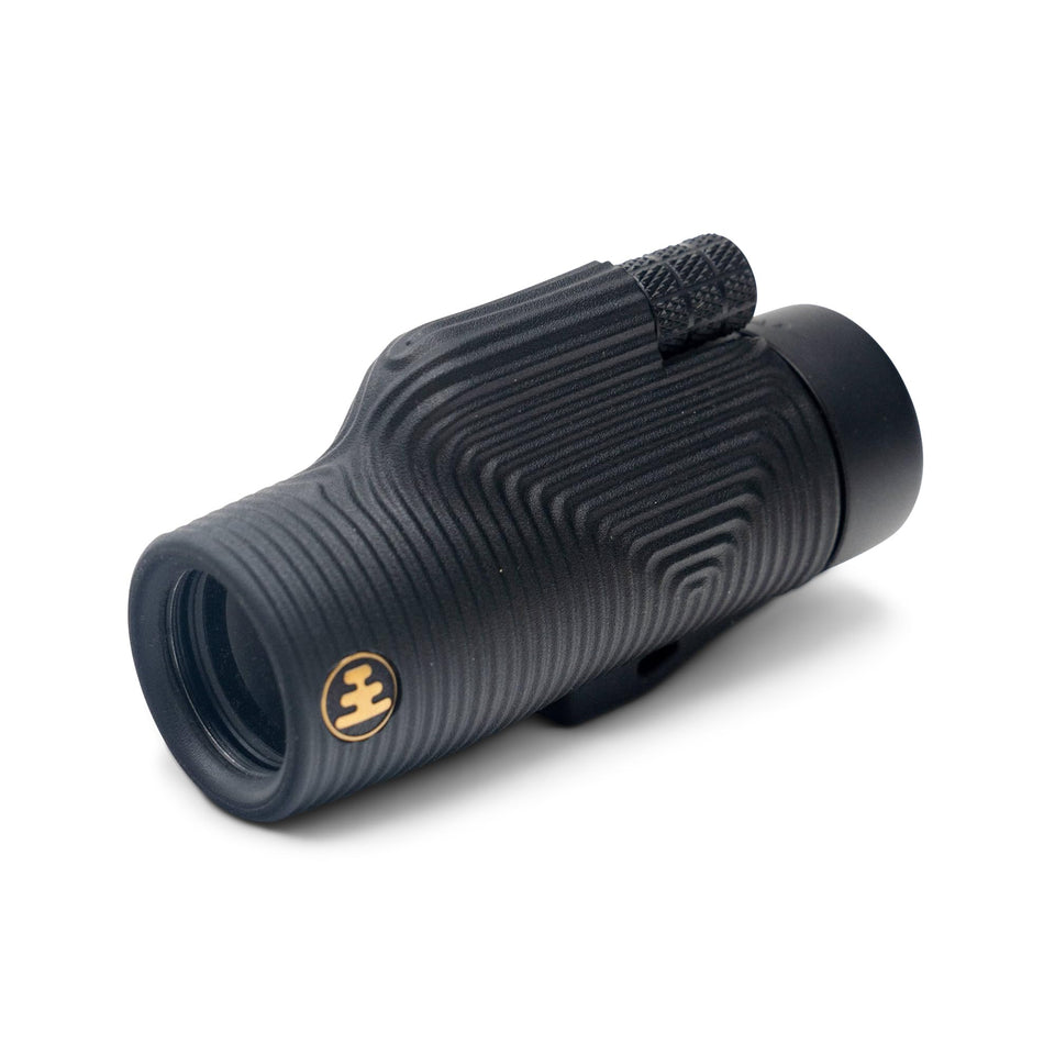 Nocs Provisions Zoom Tube 8x32 monocular in hand for portable travel viewing