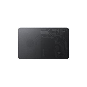 NOMAD tracking card front view showing slim carbide finish and branding for discreet tracking