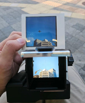 NONS Instant Back on camera body with film back open shows easy loading access.