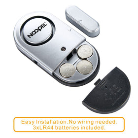 Noopel door alarm magnet close-up, shows sensor contact for immediate alerts.