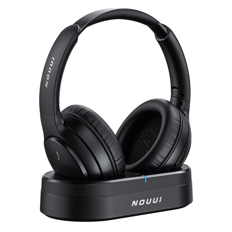 NOUUI wireless headphones beside the TV transmitter dock for quick pairing