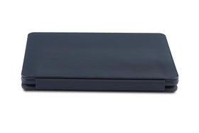 Nupro case next to a notebook showing size comparison and easy portability