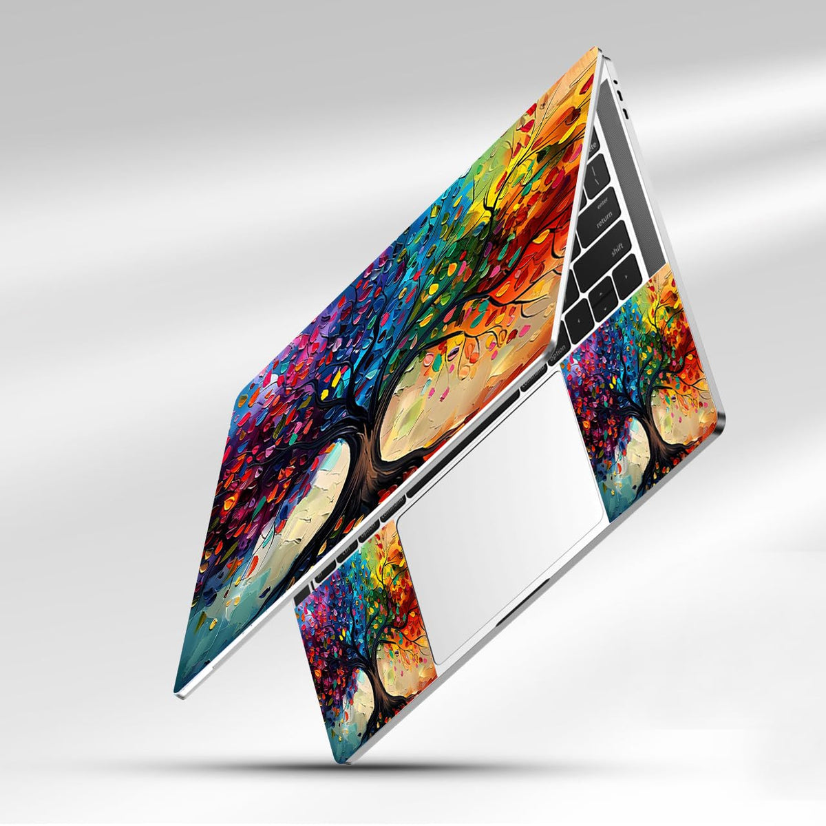 NXZGO Colorful Tree touchpad left guards surface while adding personality.