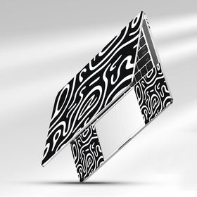 NXZGO desk scene with topographic black laptop skin applied