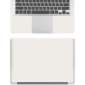 NXZGO vanilla cream laptop skin back view demonstrates cohesive styling and surface protection.
