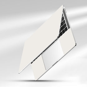 NXZGO vanilla cream laptop skin side pads highlight precise fit and touchpad protection.