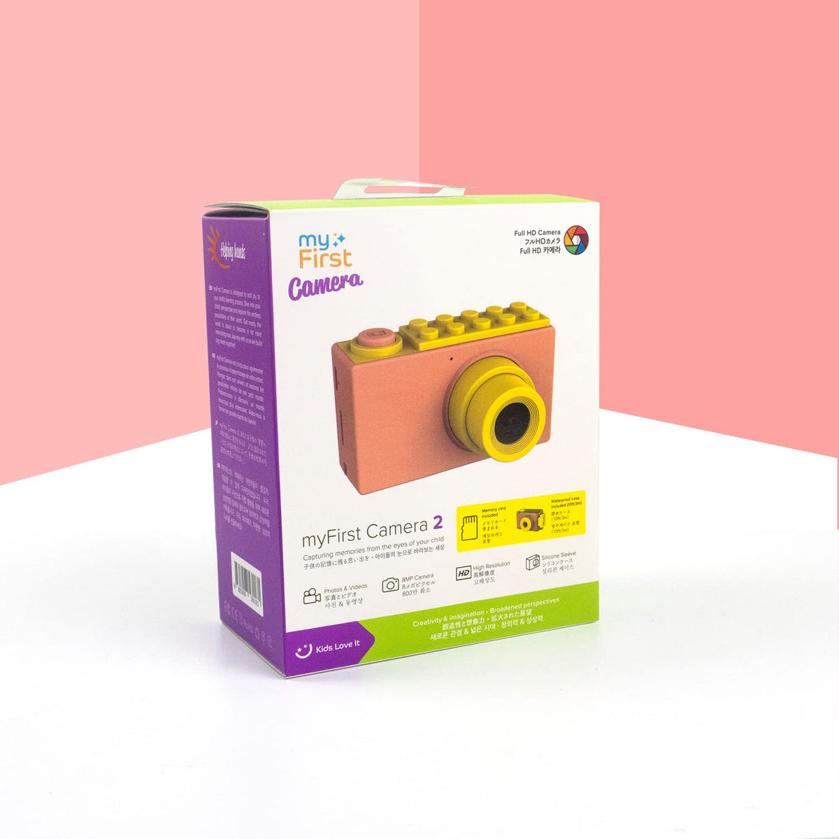 Oaxis myFirst Camera 2 on a beach towel showing lifestyle use and travel-friendly design