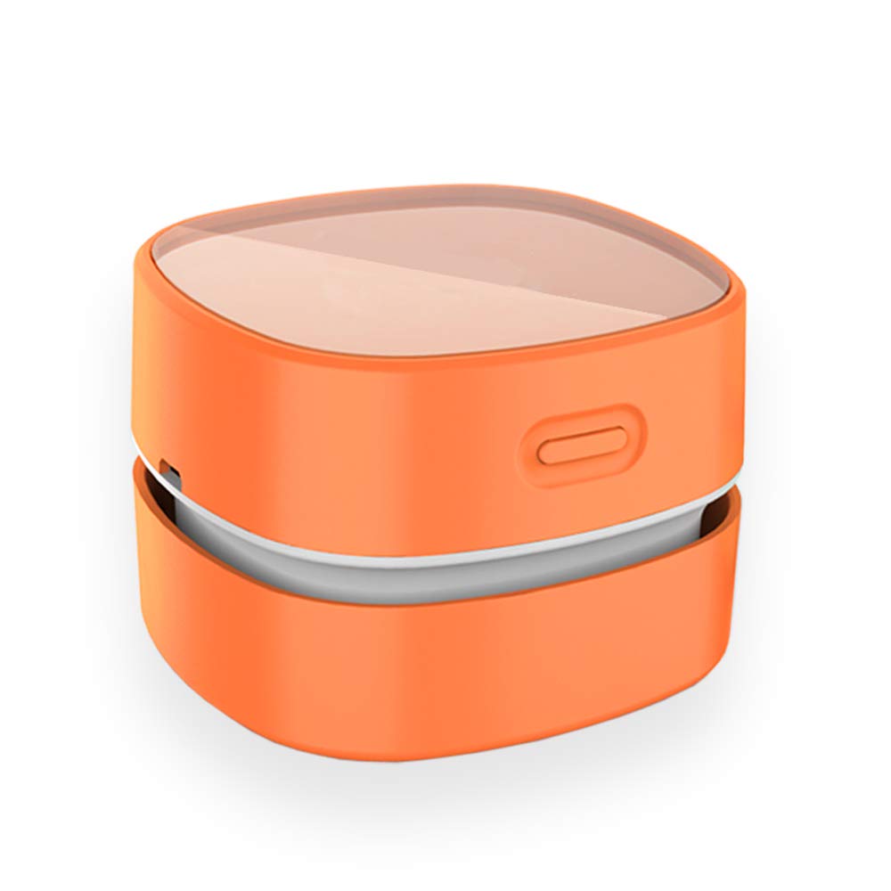 ODISTAR desktop vacuum cleaner nozzle captures keyboard debris for easy desk cleanup