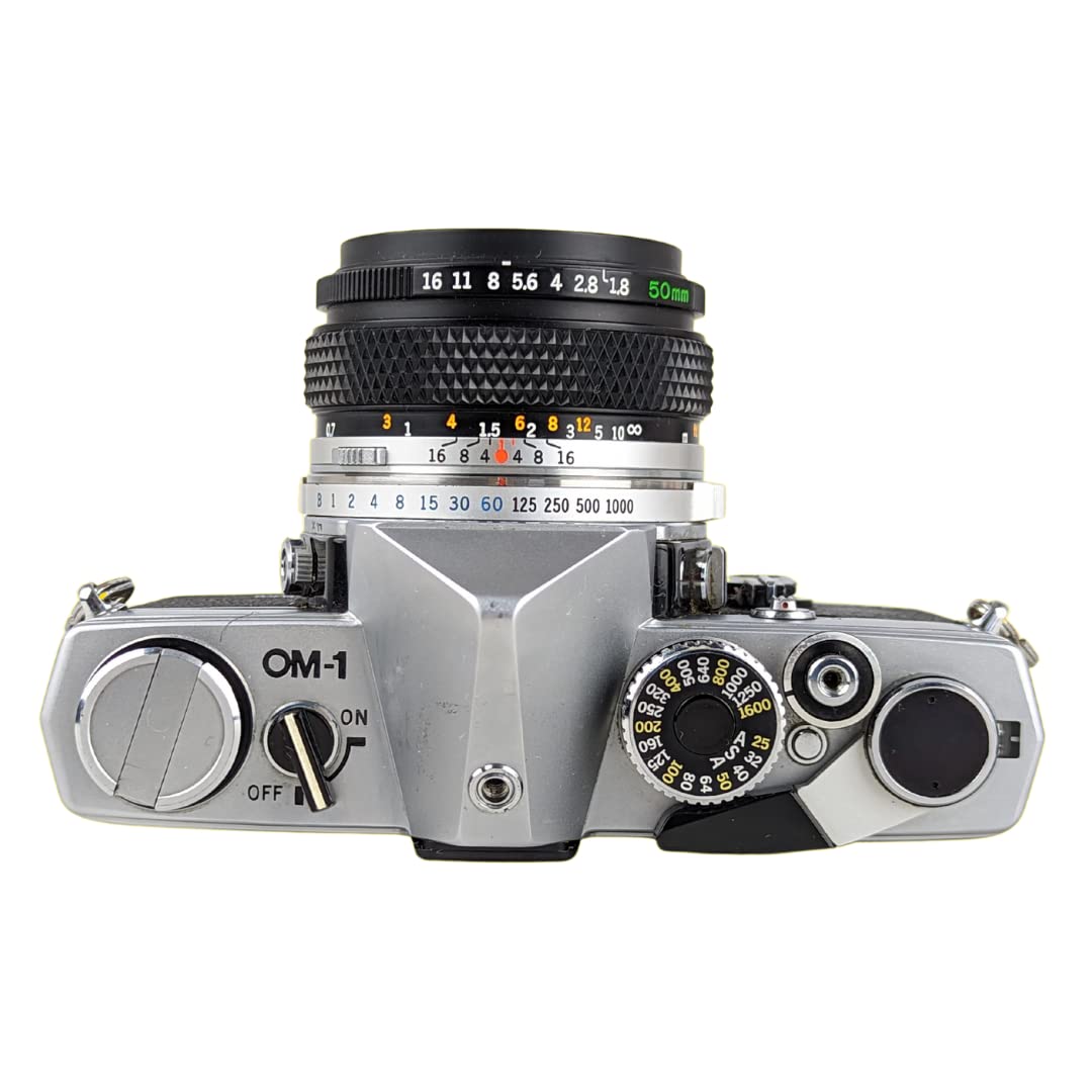Olympus OM-1 film advance lever close-up showing mechanical feedback.