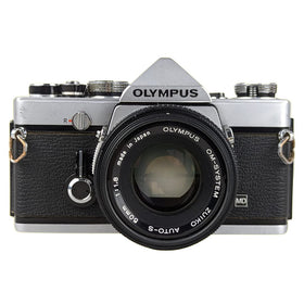 Olympus OM-1 vintage camera front view for retro photography enthusiasts.