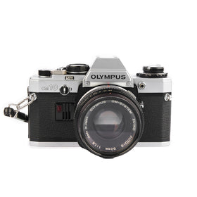 Olympus OM-10 front view showing compact body ideal for daily street photography