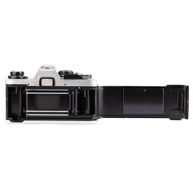 Olympus OM-10 side profile illustrating slim ergonomics for comfortable handling