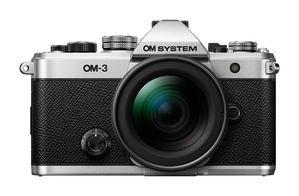 OM SYSTEM OM-3 silver front view showing premium build for travel