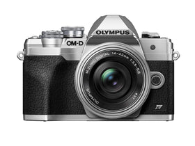 OM SYSTEM OM-D E-M10 Mark IV front view shows compact silver body ideal for street photography