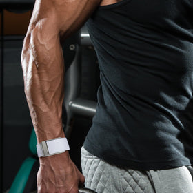 omee band on swimmer’s wrist demonstrating water-resistant performance