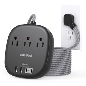 One Beat 10 ft extension cord powers multiple devices on a desk.