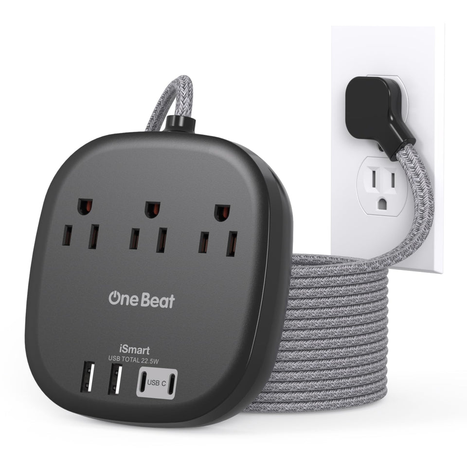 One Beat 10 ft extension cord powers multiple devices on a desk.