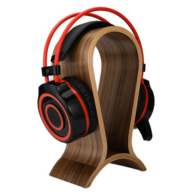 ONEGenug walnut stand shows middle cable slot for tidy headphone cables.