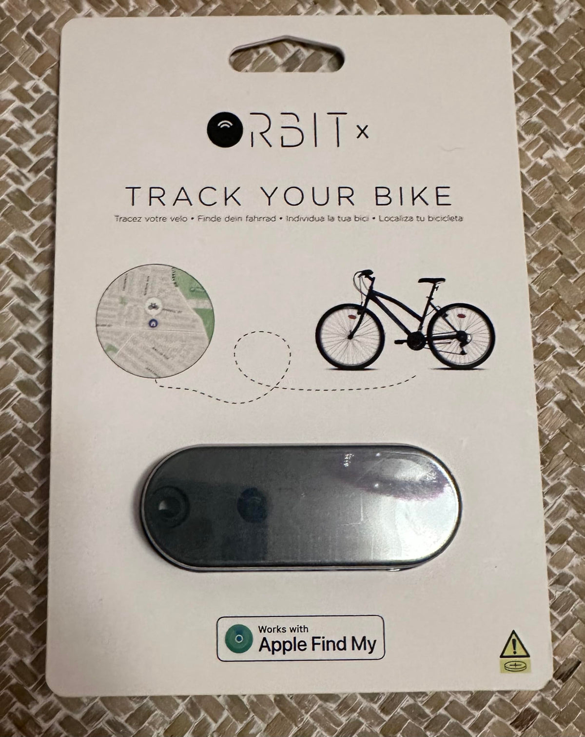 ORBIT Velo on a commuter bike in city setting showing peace-of-mind tracking benefit