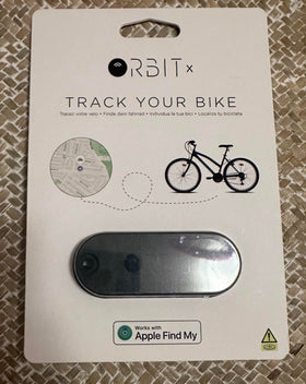 ORBIT Velo on a commuter bike in city setting showing peace-of-mind tracking benefit