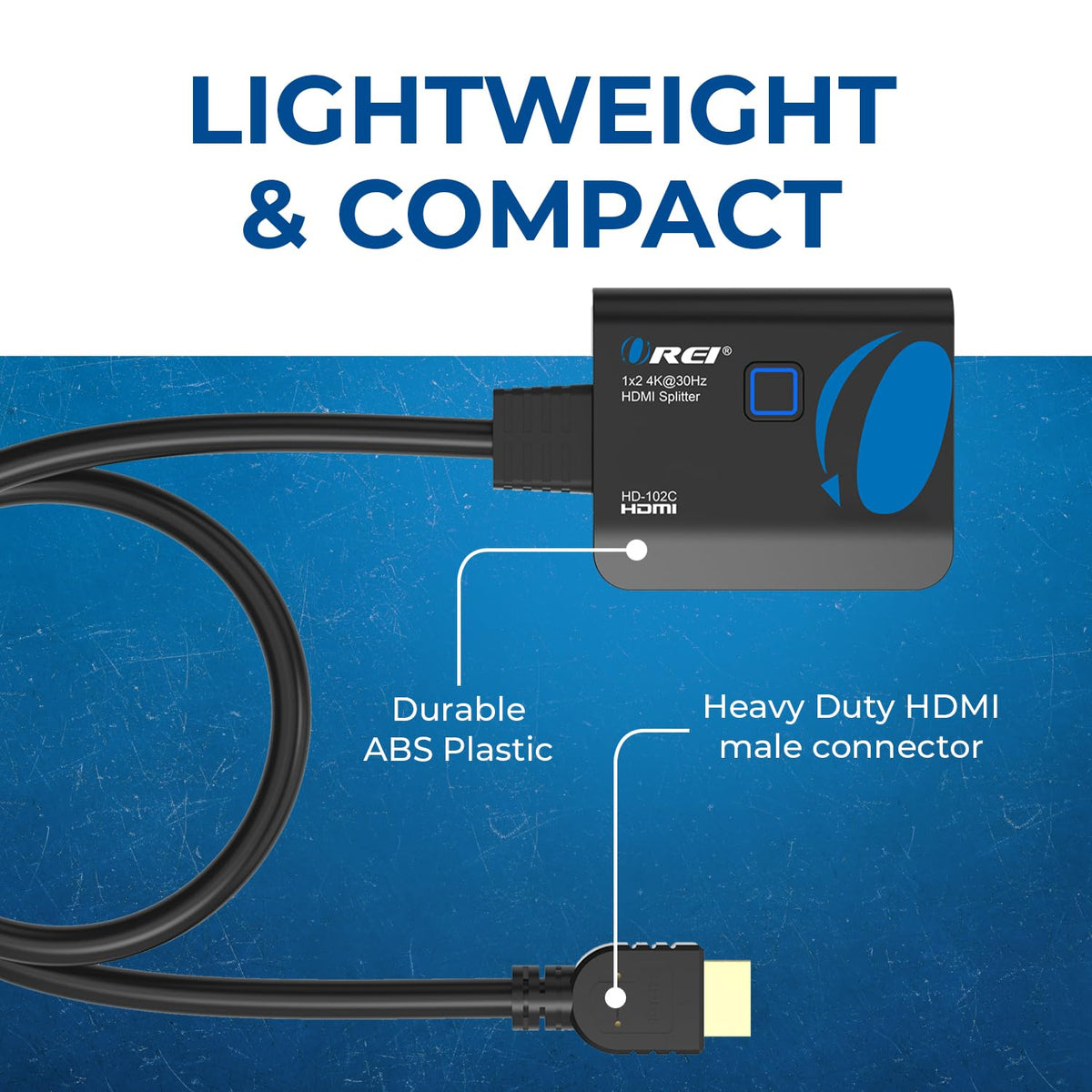 OREI compact HDMI splitter resting on a desk with cables