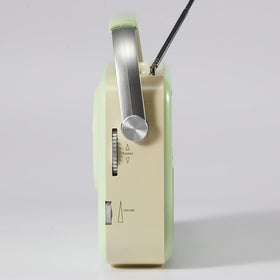 Ottosing green radio designed for outdoor use on camping trips and patios.