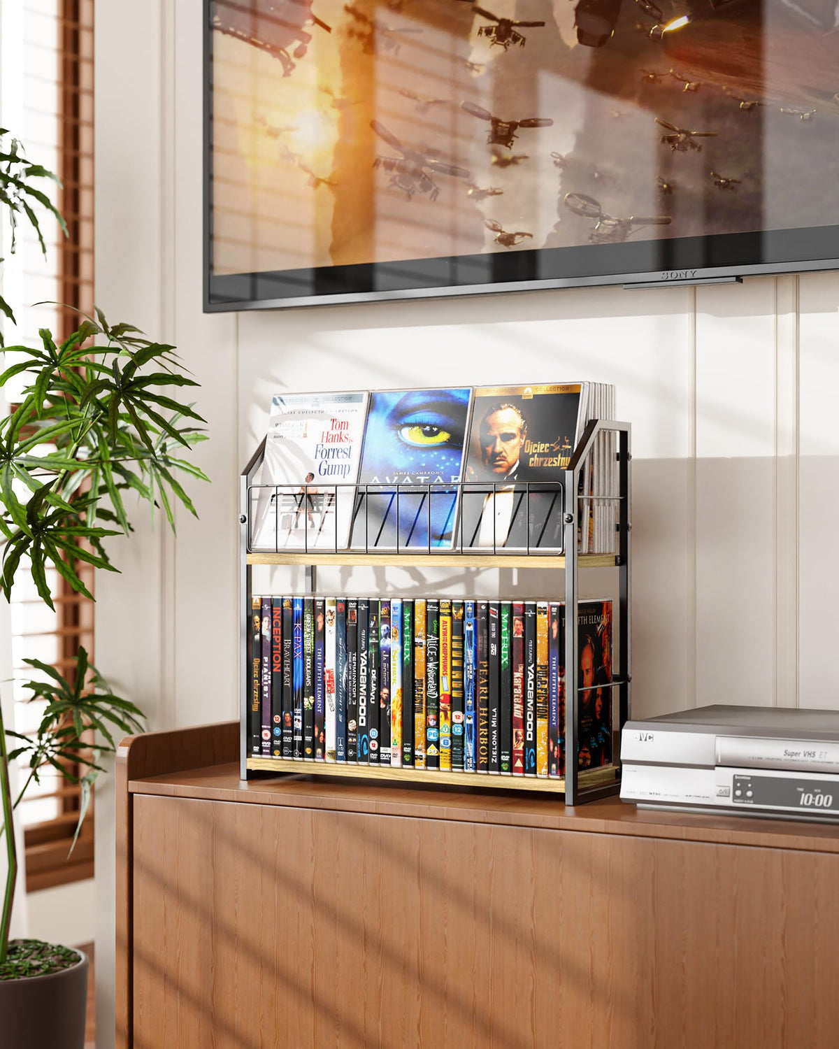 PAPAGIFTREE beside stacked DVD cases for scale demonstrating compact footprint and high capacity
