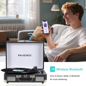 Pareiko on picnic blanket showing portable playback and outdoor entertainment benefit