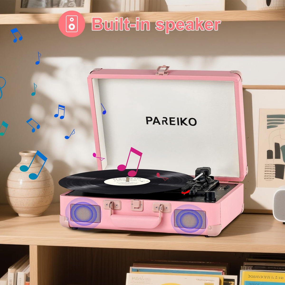 Pareiko beside a hand to show compact size and travel-friendly benefit