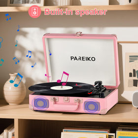 Pareiko beside a hand to show compact size and travel-friendly benefit