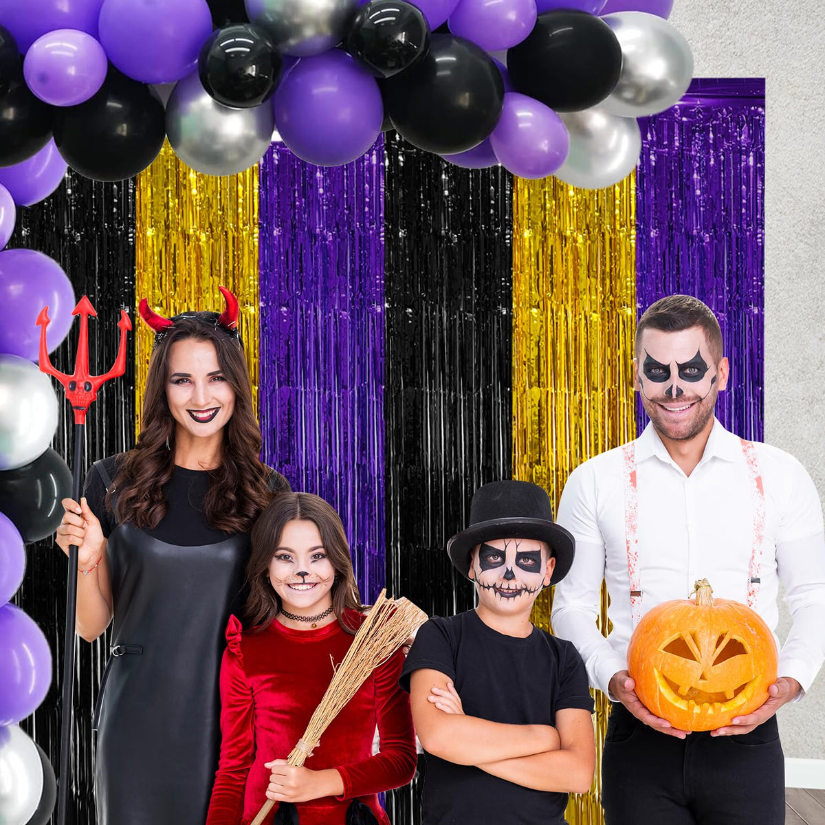 The purple gold black fringe backdrop helps create a striking party photo booth.