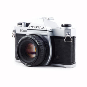 Top controls show aperture and shutter speed dials for tactile shooting
