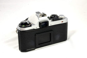 Pentax ME Super 50mm lens close-up highlighting bright f/1.4 performance in low light.