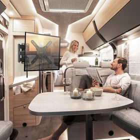 Perlegear mounted TV inside RV showing comfortable family viewing setup