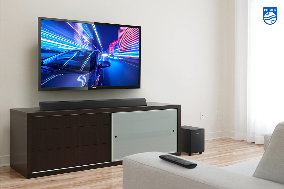Cozy living room setup with Philips B5306 under TV for compact home theater