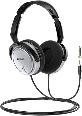 Philips headphones on desk with computer setup