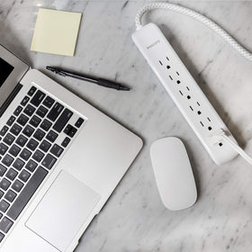 PHILIPS in-use entertainment setup powering TV and console with surge protection benefit