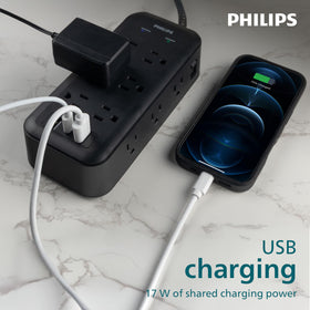 PHILIPS power strip powering desk monitors and laptop in a home office for tidy cable management