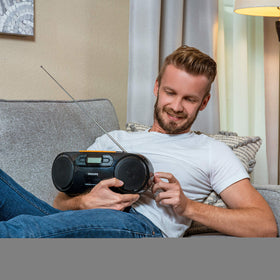 PHILIPS portable stereo with shuffle and program modes for customization.