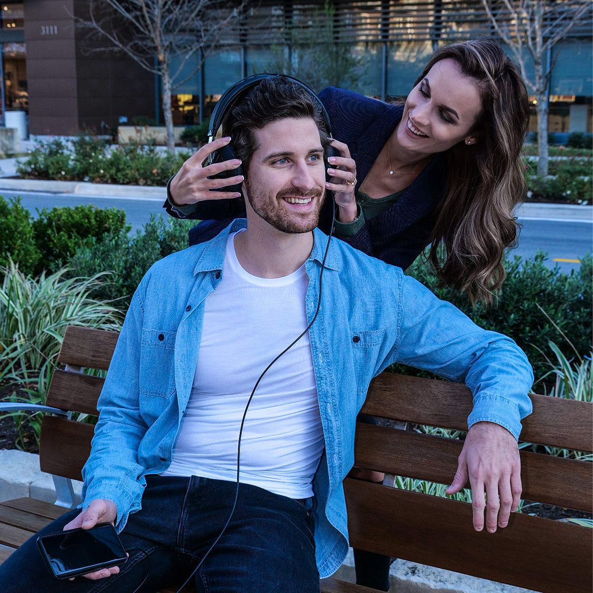 PHILIPS SHP6000 held in hand to show size and portability for travel and practice