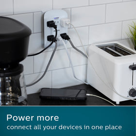 Philips size comparison against standard outlet showing compact wall tap footprint
