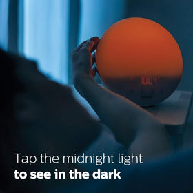 Philips SmartSleep round bedside light design for discreet placement.