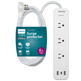 PHILIPS surge protector with three outlets and USB ports for organized device charging.