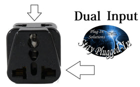 Plug-in-Solutions adapter plugged into hotel wall outlet powering a phone charger