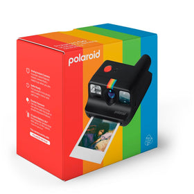 Polaroid Go lens cleaning cloth and wrist strap laid out for maintenance — Polaroid reliable upkeep